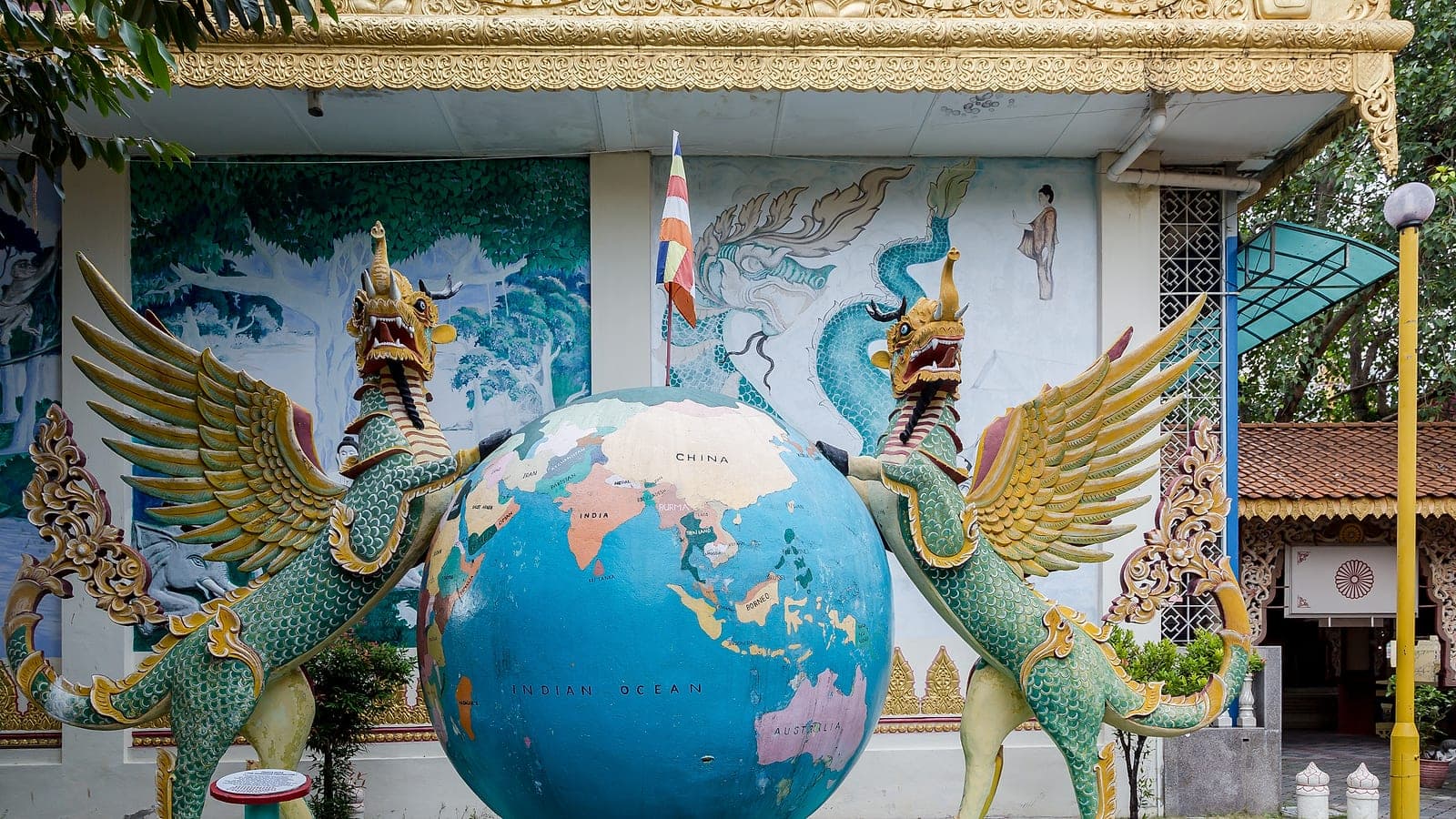 Mythical guardian figures along the temple grounds