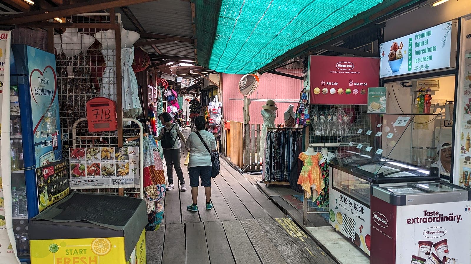 Shops and stilt homes along the jetty walkway